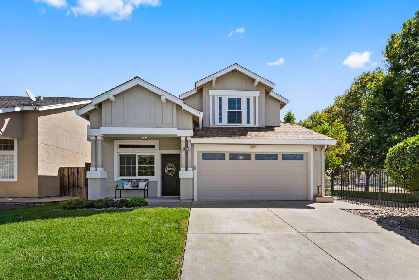 9310 Hirasaki Avenue Gilroy, CA 95020 - Photo 2 of 30 a front view of a house with a garden and yard