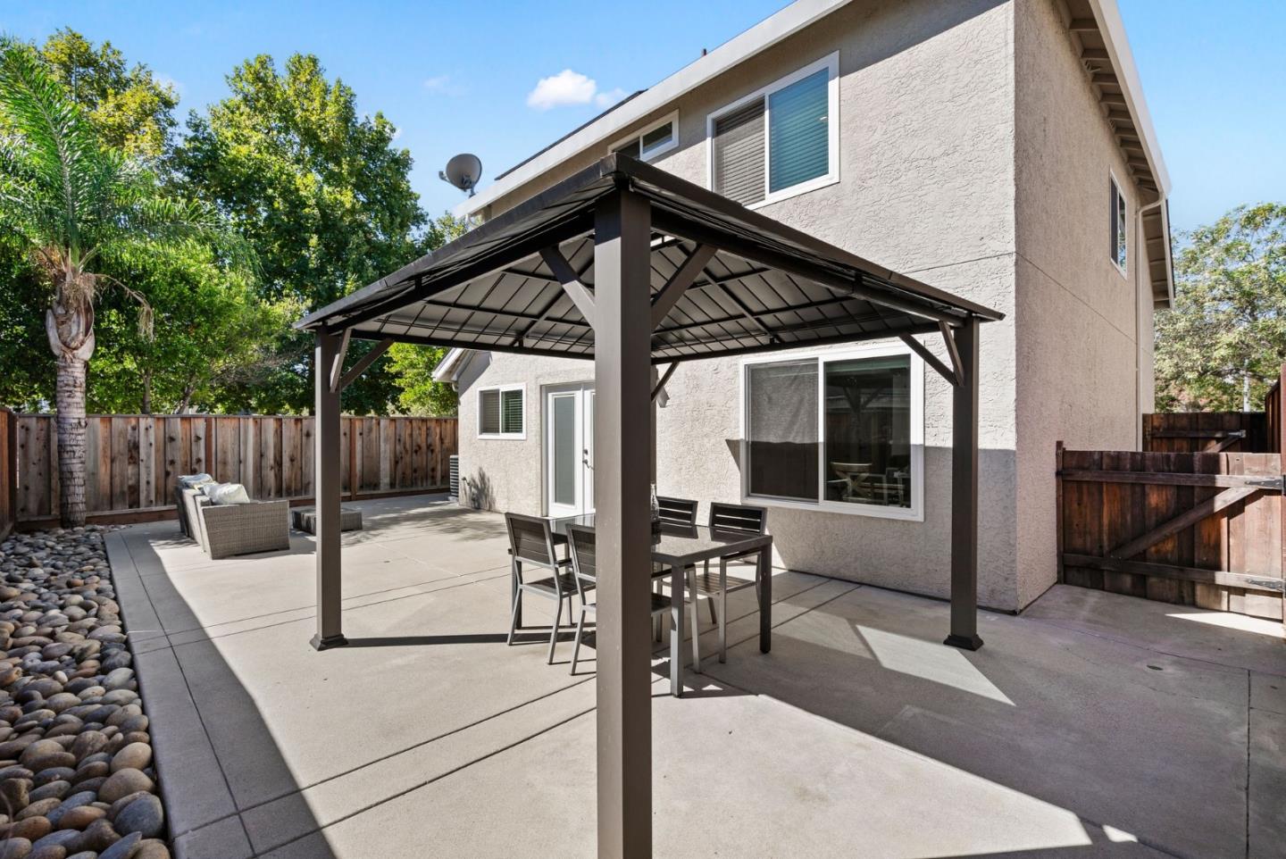 9310 Hirasaki Avenue Gilroy, CA 95020 - Photo 21 of 30 a view of a backyard with sitting area