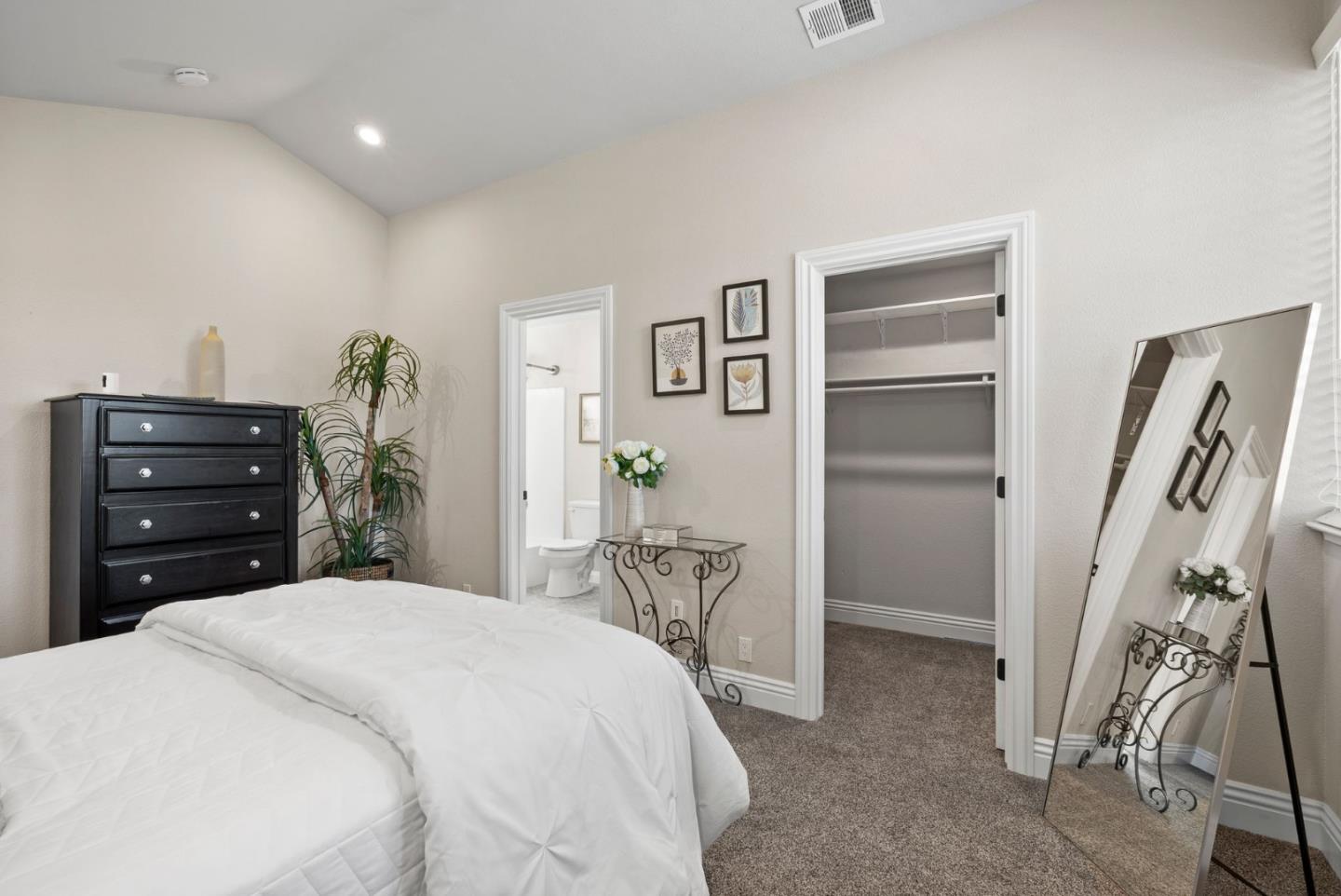 9310 Hirasaki Avenue Gilroy, CA 95020 - Photo 24 of 30 a bedroom with a bed and a cabinets