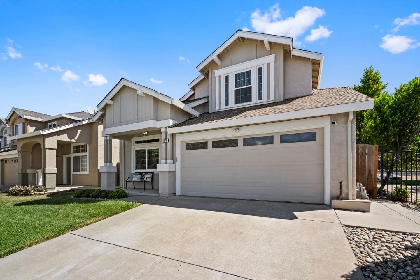 9310 Hirasaki Avenue Gilroy, CA 95020 - Photo 3 of 30 a front view of a house with a yard and garage