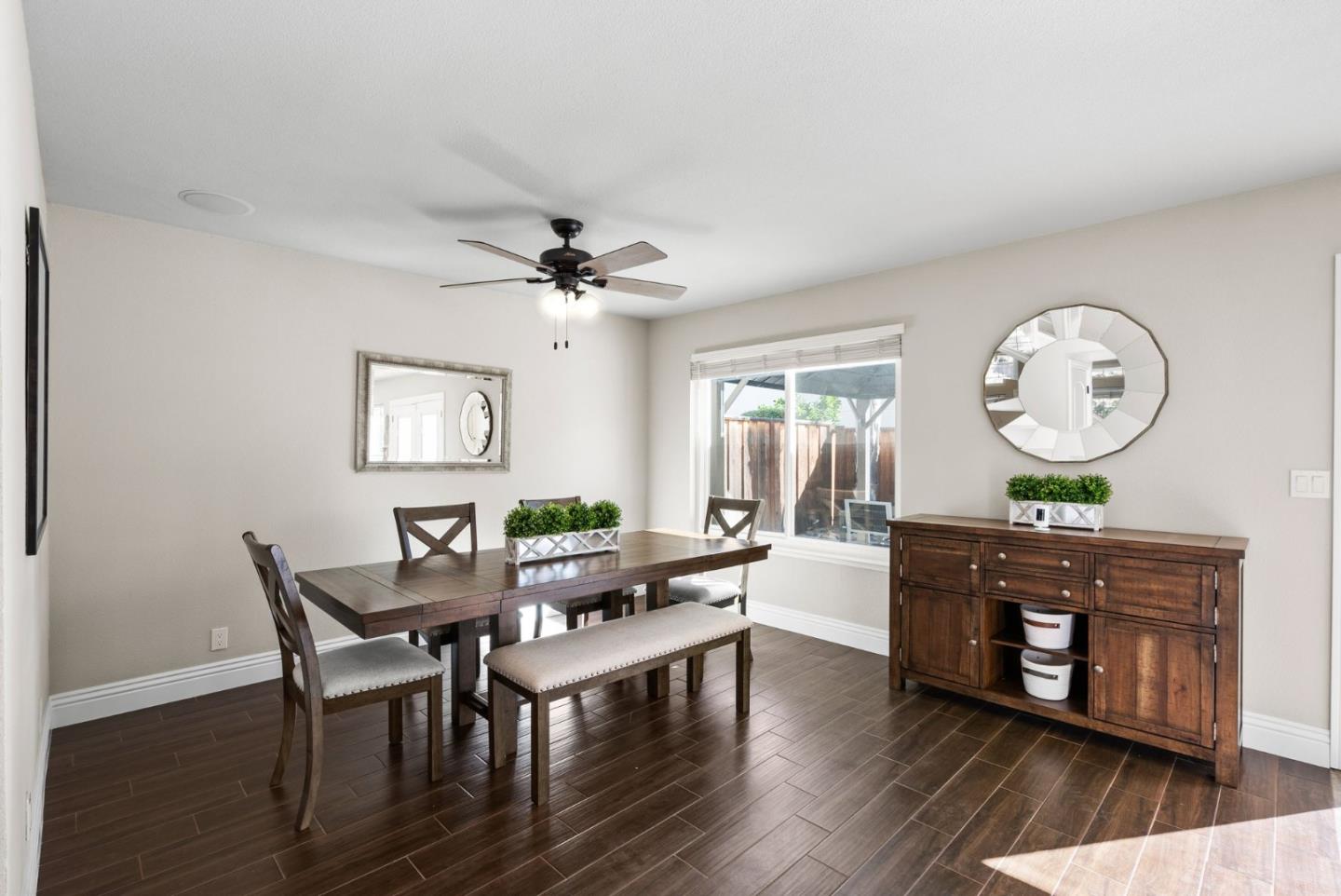 9310 Hirasaki Avenue Gilroy, CA 95020 - Photo 9 of 30 a living room with furniture and a wooden floor