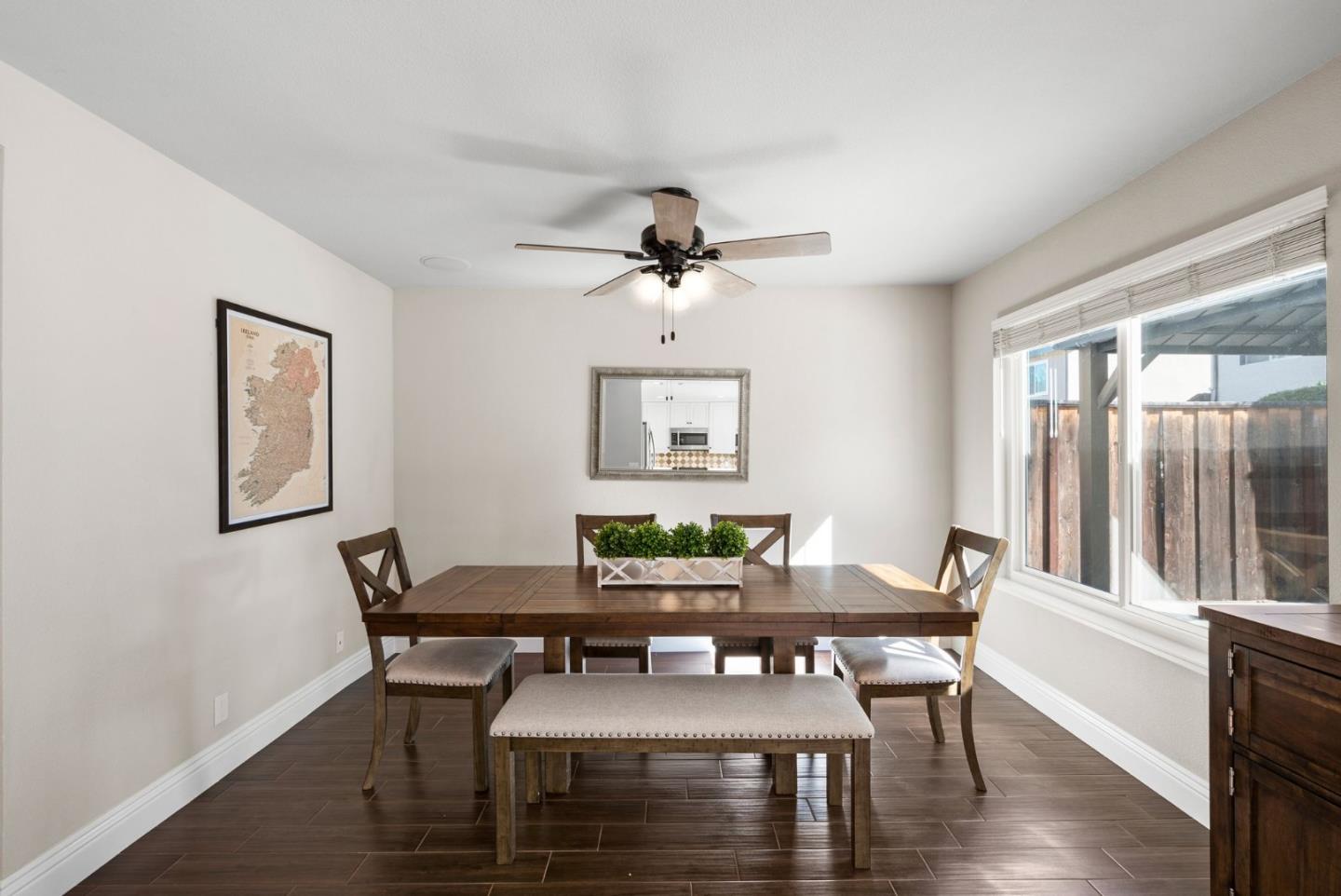 9310 Hirasaki Avenue Gilroy, CA 95020 - Photo 10 of 30 a view of a dining room with furniture window and wooden floor