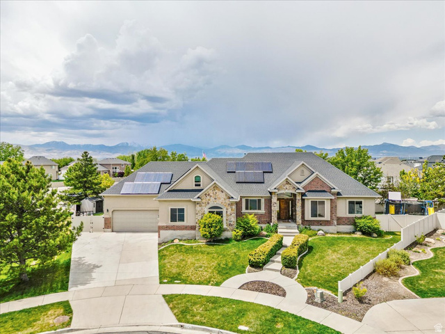 316 Azure Circle Draper, UT 84020 - Photo 2 of 48 Inviting residential exterior featuring a multi-material facade with brick and stone accents