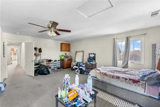 a bed room with bed and window