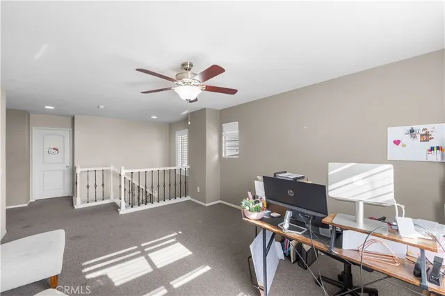 a workspace with furniture and a window