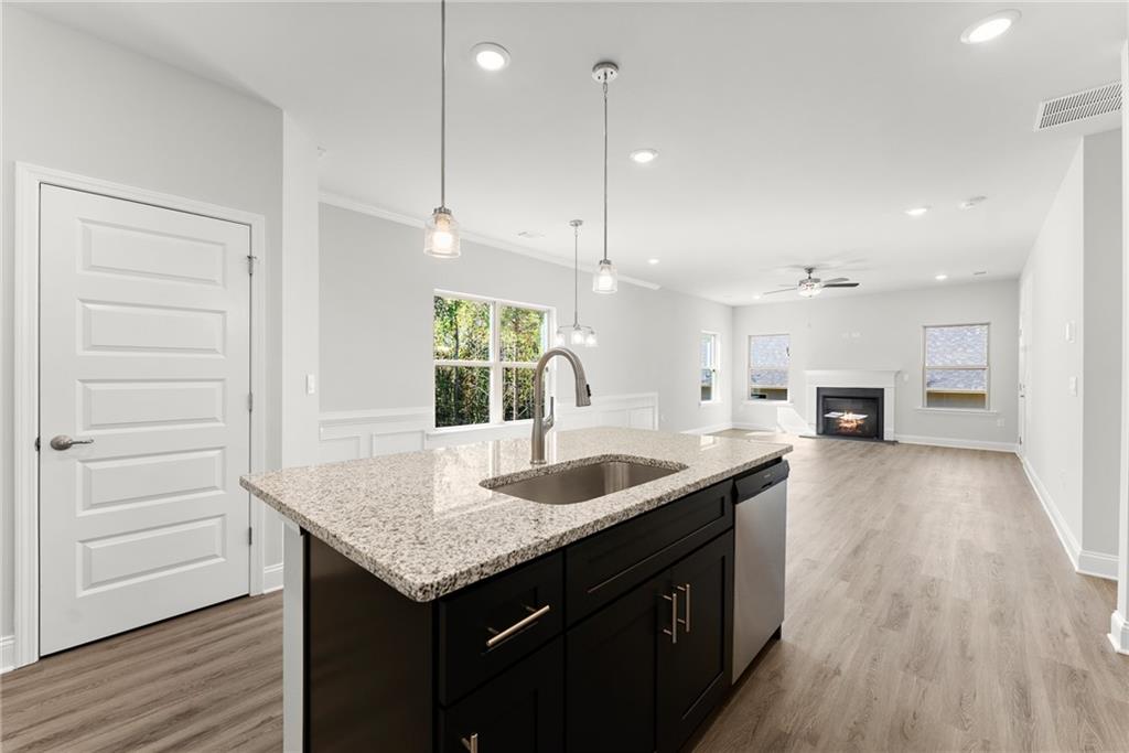 285 Magnolia Villas Drive Cornelia, GA 30531 - Photo 11 of 49 a kitchen with a sink stove and wooden floor