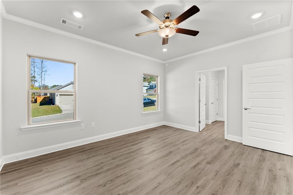 285 Magnolia Villas Drive Cornelia, GA 30531 - Photo 18 of 49 wooden floor in an empty room with a window
