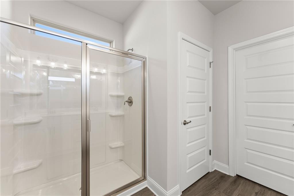 285 Magnolia Villas Drive Cornelia, GA 30531 - Photo 23 of 49 a bathroom with a glass shower door