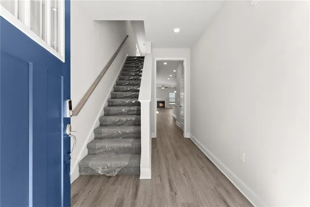 a view of entryway with wooden floor