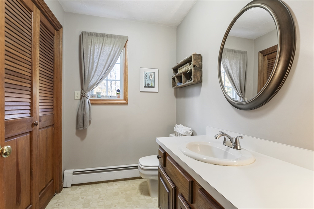 103 Uxbridge Street Douglas, MA 01569 - Photo 18 of 38 a bathroom with a sink and a mirror