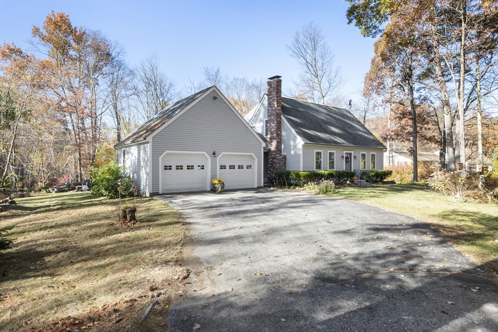 103 Uxbridge Street Douglas, MA 01569 - Photo 2 of 38 a view of a house with a yard covered in snow