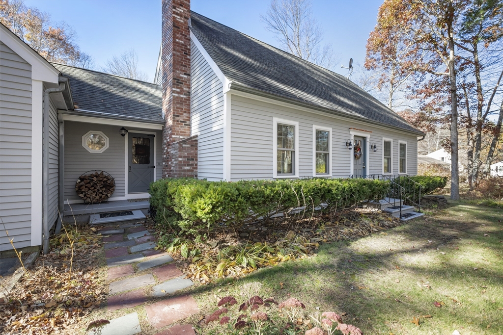 103 Uxbridge Street Douglas, MA 01569 - Photo 3 of 38 a house view with a garden space