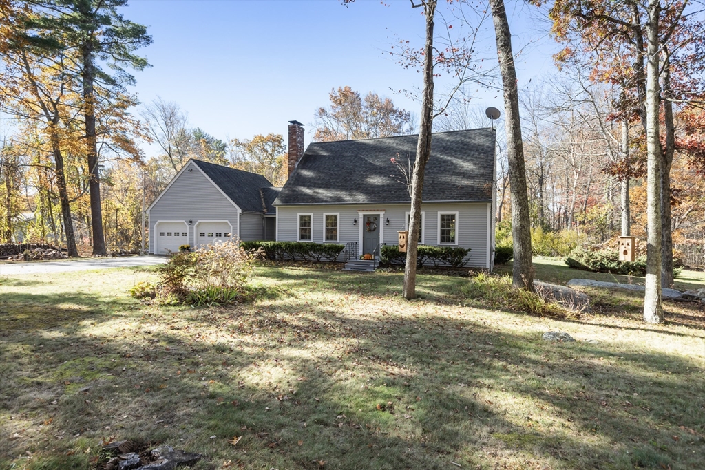 103 Uxbridge Street Douglas, MA 01569 - Photo 4 of 38 a house that has a tree in front of it