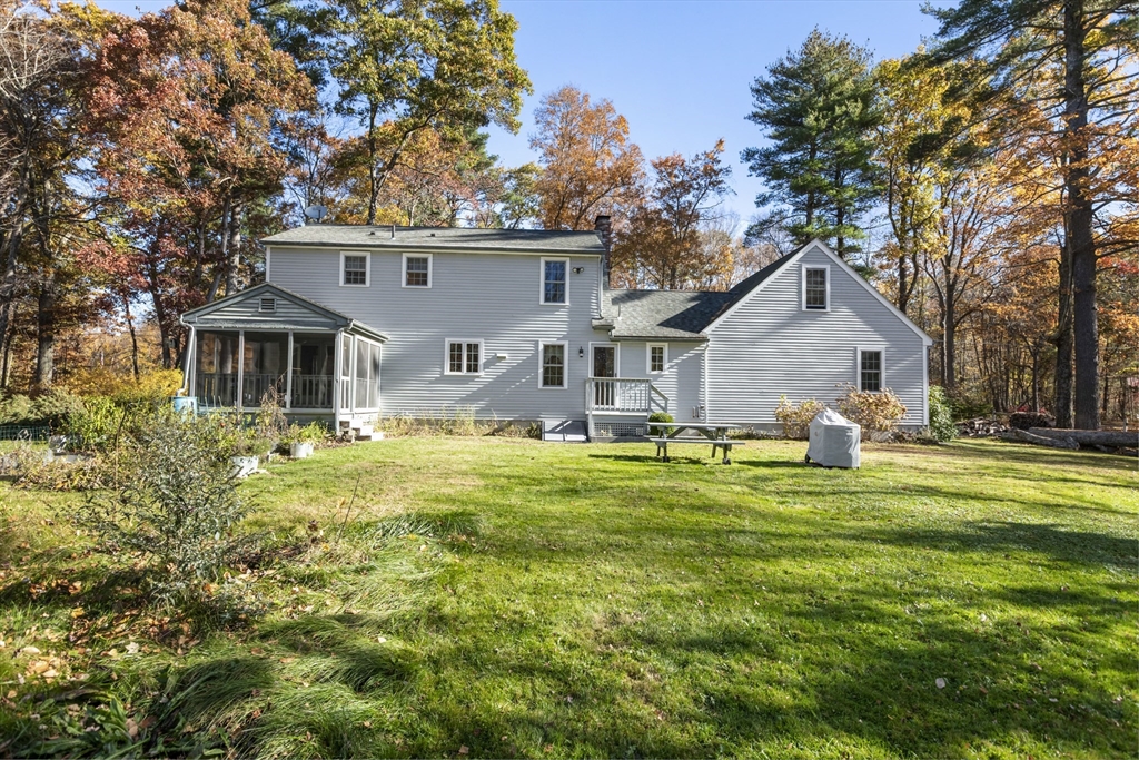 103 Uxbridge Street Douglas, MA 01569 - Photo 9 of 38 a front view of house with yard and green space