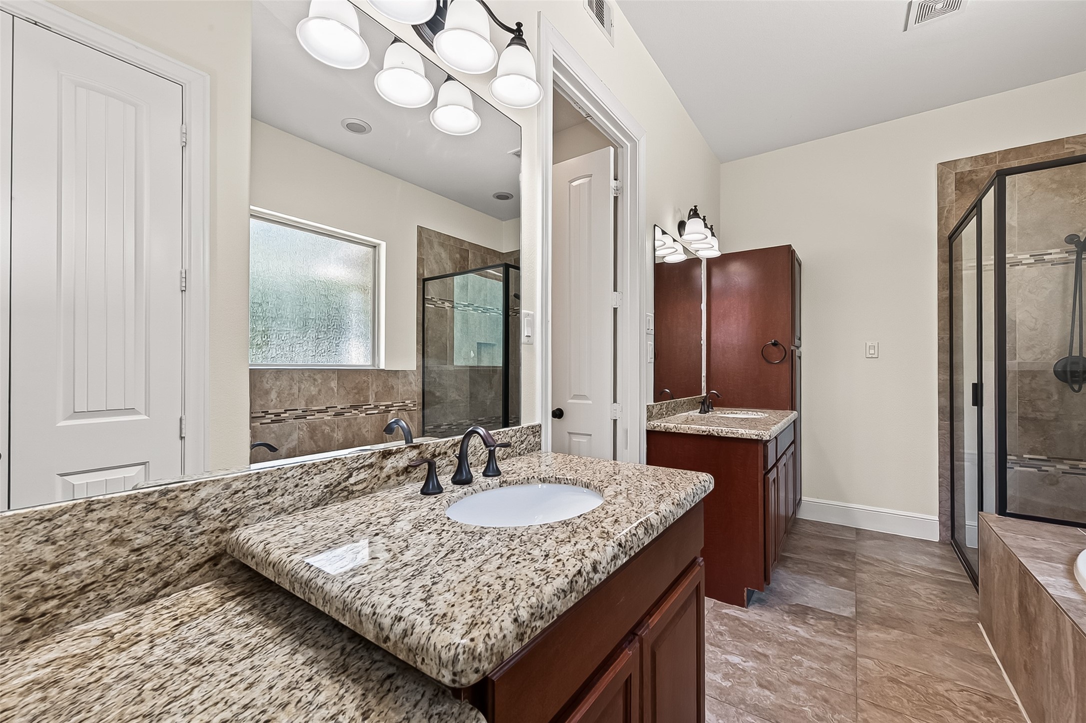 22040 Robins Road Hockley, TX 77447 - Photo 22 of 44 Granite countertops in primary bathroom
