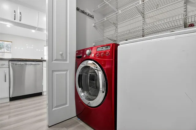 a utility room with dryer and washer