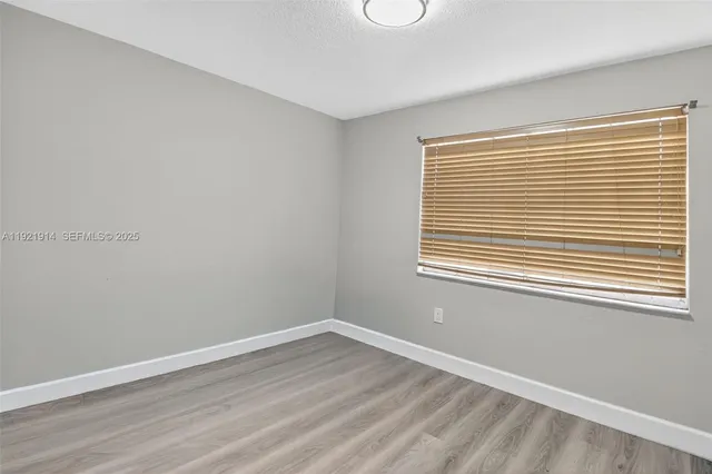 a view of a room that has a window in it