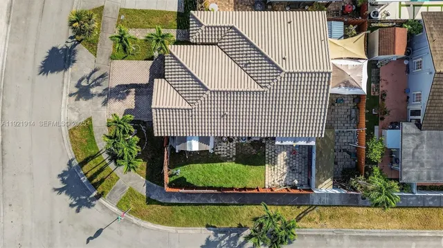 a aerial view of a house with a garden and plants