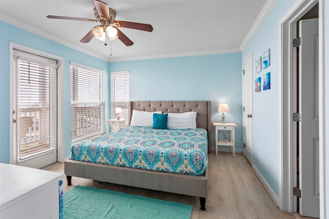 10811 Termini-San Luis Pass Road, Unit 1307 Galveston, TX 77554 - Photo 14 of 28 a bed room with a bed and a window