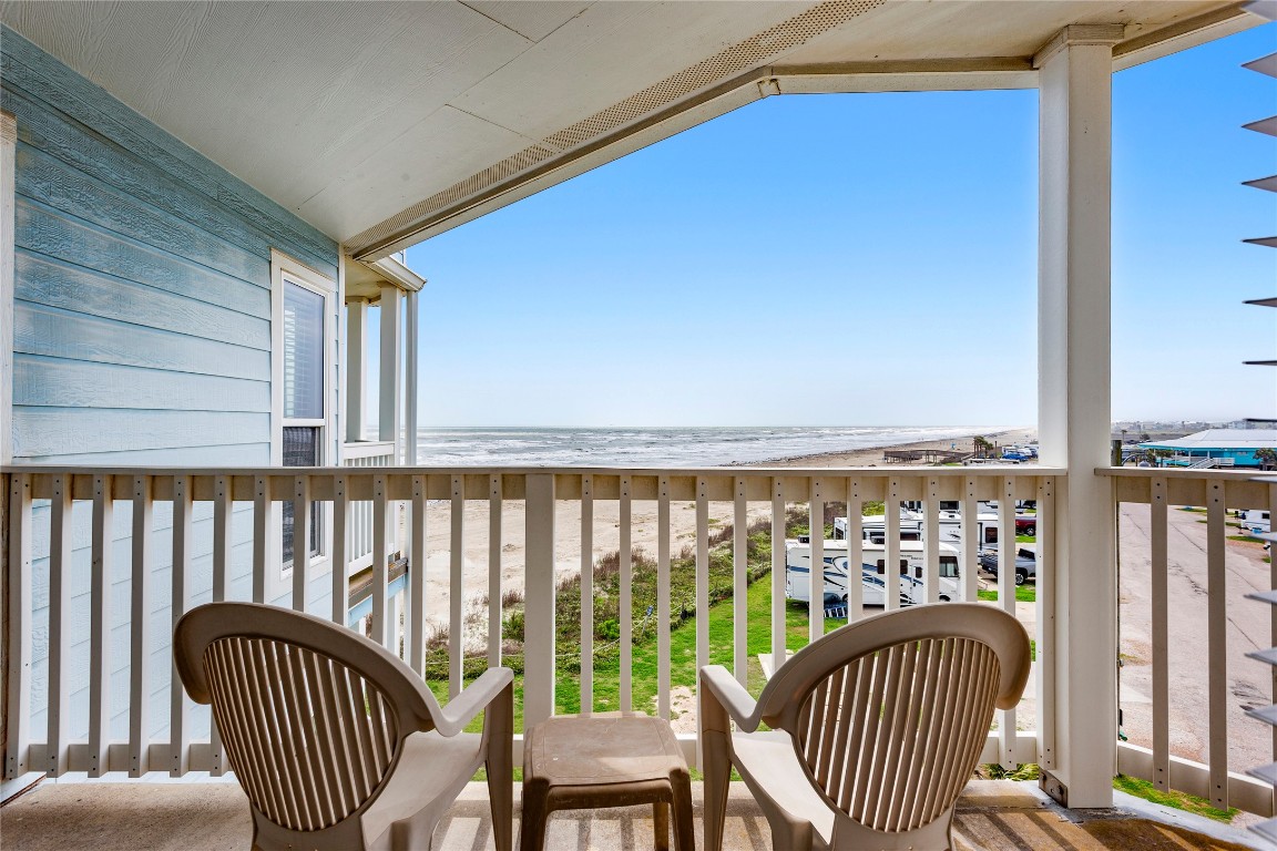 10811 Termini-San Luis Pass Road, Unit 1307 Galveston, TX 77554 - Photo 16 of 28 a view of a balcony with furniture