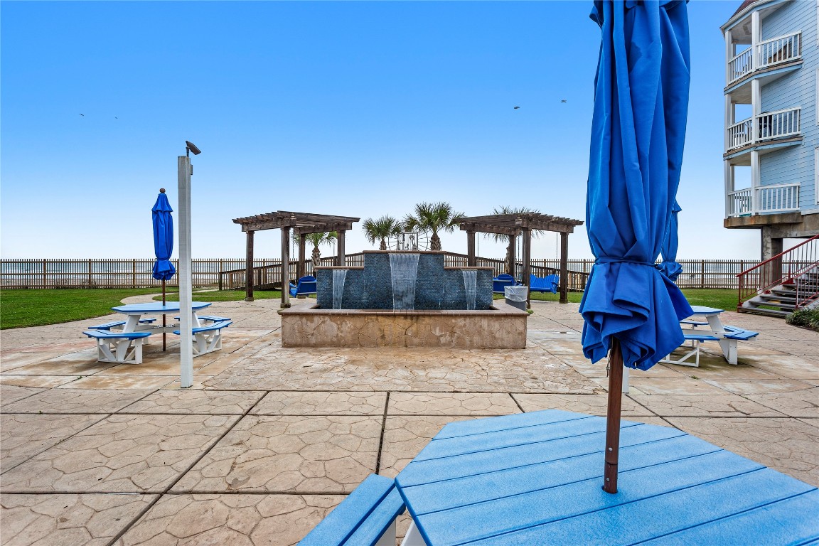 10811 Termini-San Luis Pass Road, Unit 1307 Galveston, TX 77554 - Photo 23 of 28 a view of swimming pool with outdoor seating