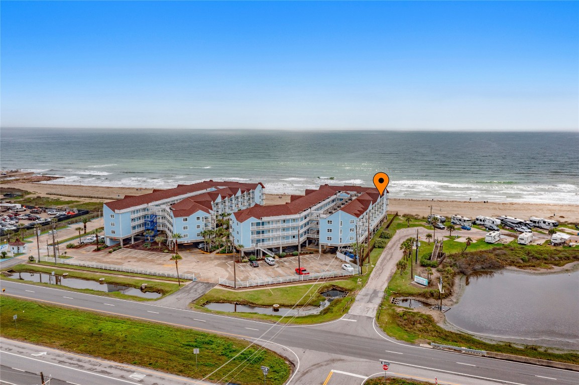 10811 Termini-San Luis Pass Road, Unit 1307 Galveston, TX 77554 - Photo 24 of 28 an aerial view of residential houses with outdoor space
