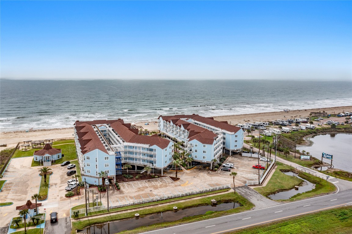 10811 Termini-San Luis Pass Road, Unit 1307 Galveston, TX 77554 - Photo 25 of 28 an aerial view of residential houses with outdoor space