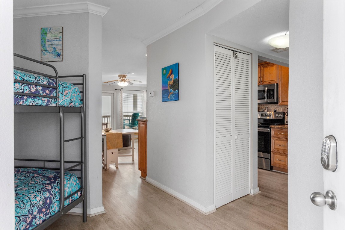 10811 Termini-San Luis Pass Road, Unit 1307 Galveston, TX 77554 - Photo 5 of 28 a view of hallway with livingroom and furniture