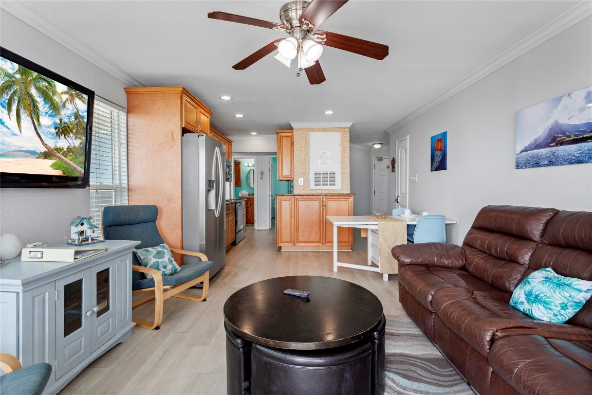 10811 Termini-San Luis Pass Road, Unit 1307 Galveston, TX 77554 - Photo 8 of 28 a living room with furniture and a flat screen tv