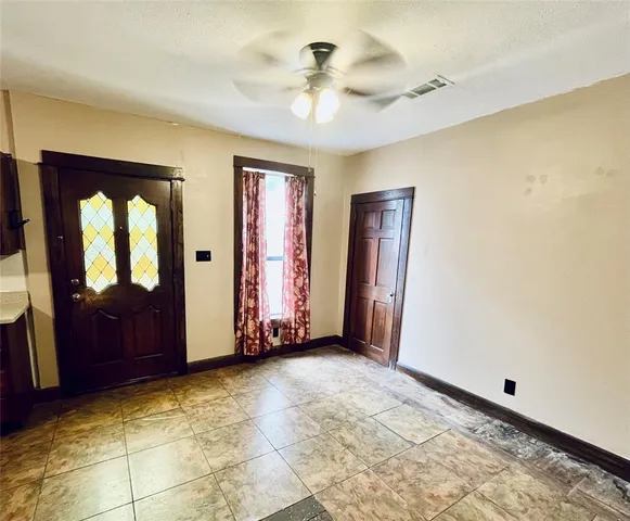 a view of an empty room and window