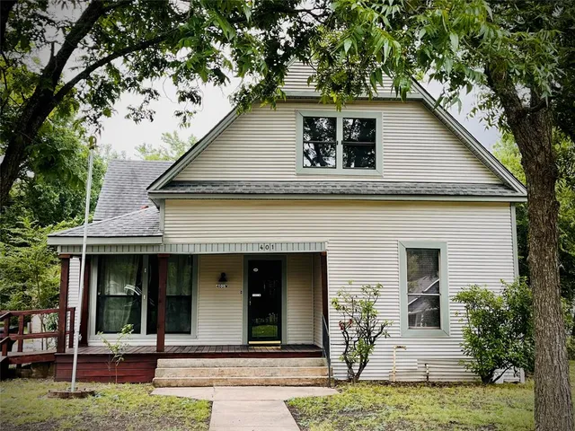 a house with palm tree in front of it