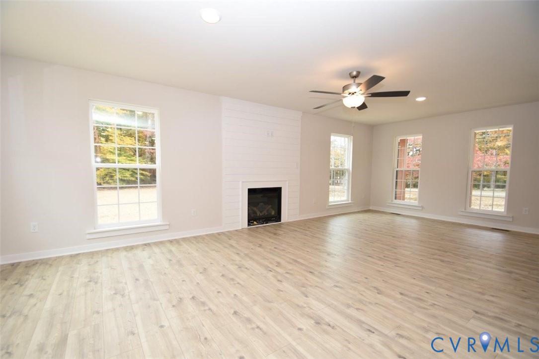 375 Amick Road Louisa, VA 23093 - Photo 12 of 25 a view of an empty room with window and wooden floor