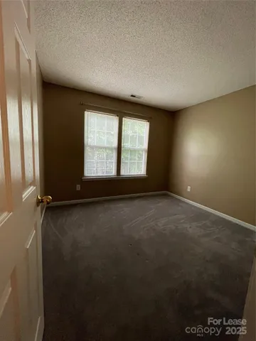 a bathroom with a sink a toilet a mirror and shower