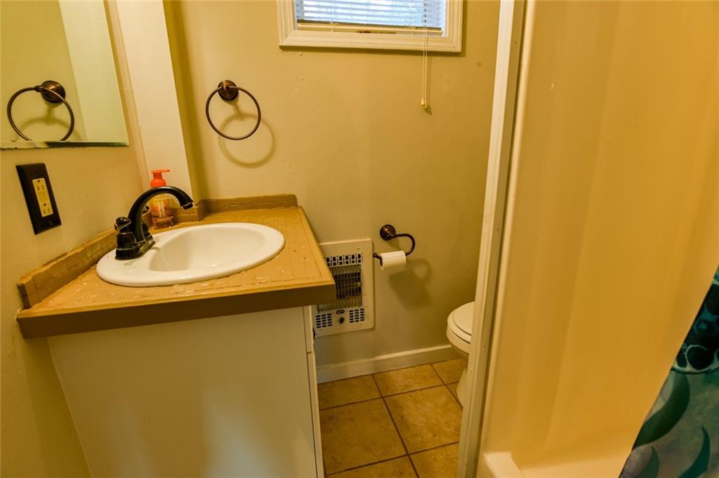 458 Haley Road Jackson, GA 30233 - Photo 13 of 47 a bathroom with a sink and mirror