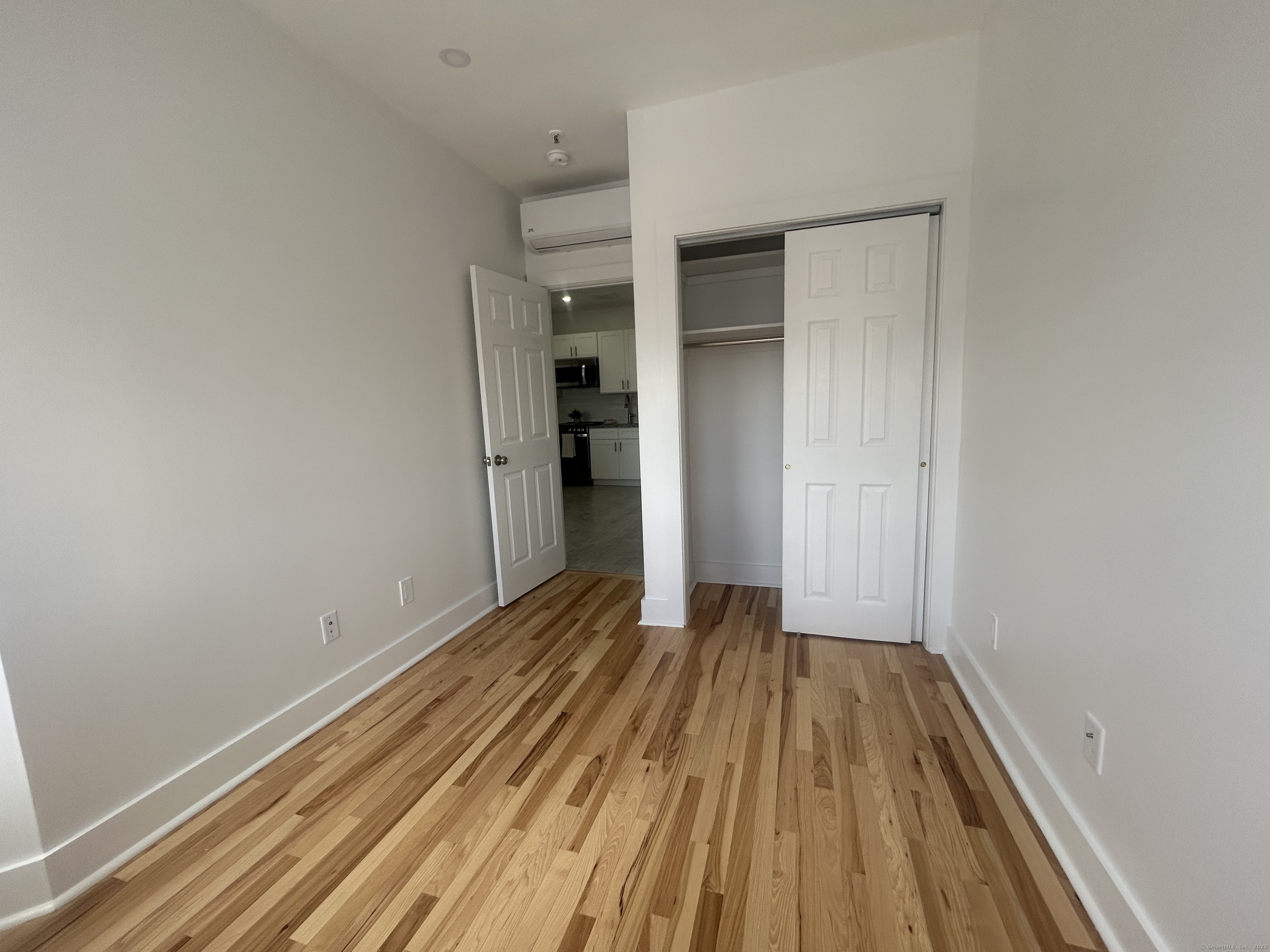 207 Bank Street, Unit 201 New London, CT 06320 - Photo 7 of 12 a view of wooden floor in a room
