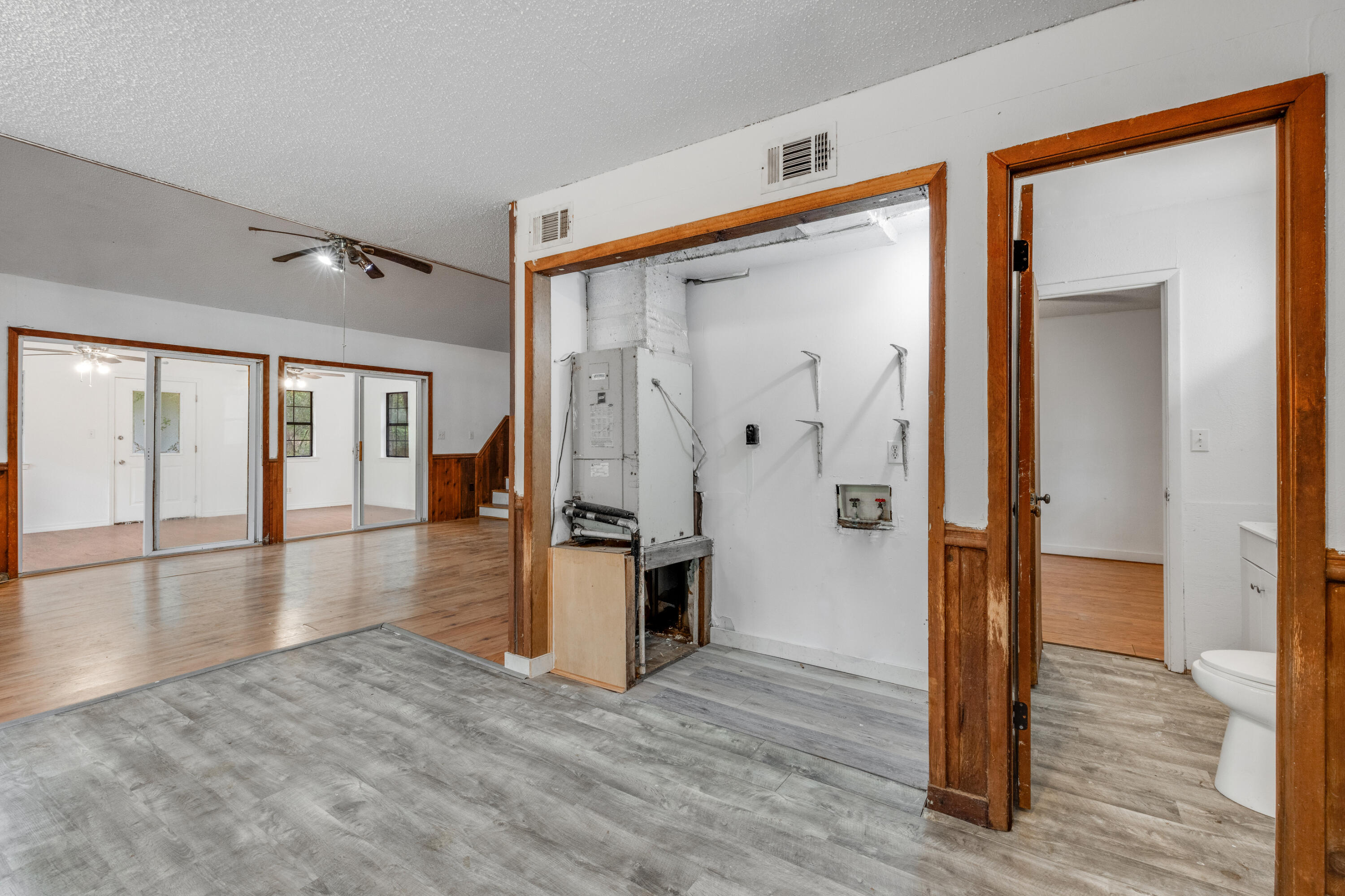 4157 Sundance Way Holt, FL 32564 - Photo 15 of 30 a view of a hallway with wooden floor and closet