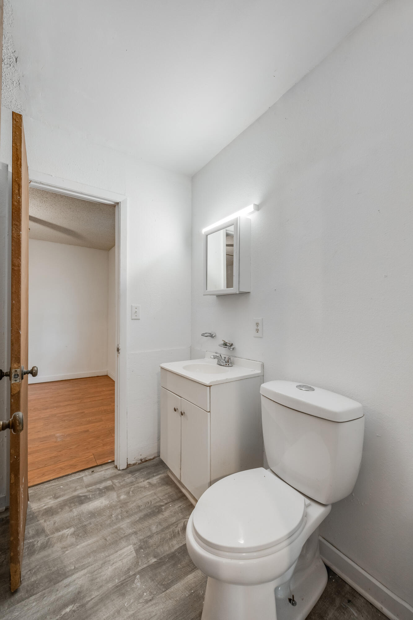 4157 Sundance Way Holt, FL 32564 - Photo 20 of 30 a white toilet sitting next to a bathroom sink