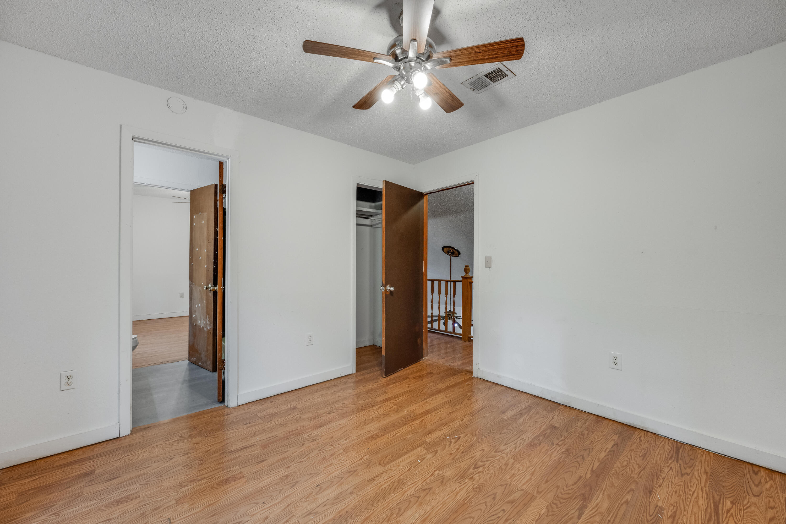 4157 Sundance Way Holt, FL 32564 - Photo 22 of 30 a view of an empty room with closet and a chandelier fan