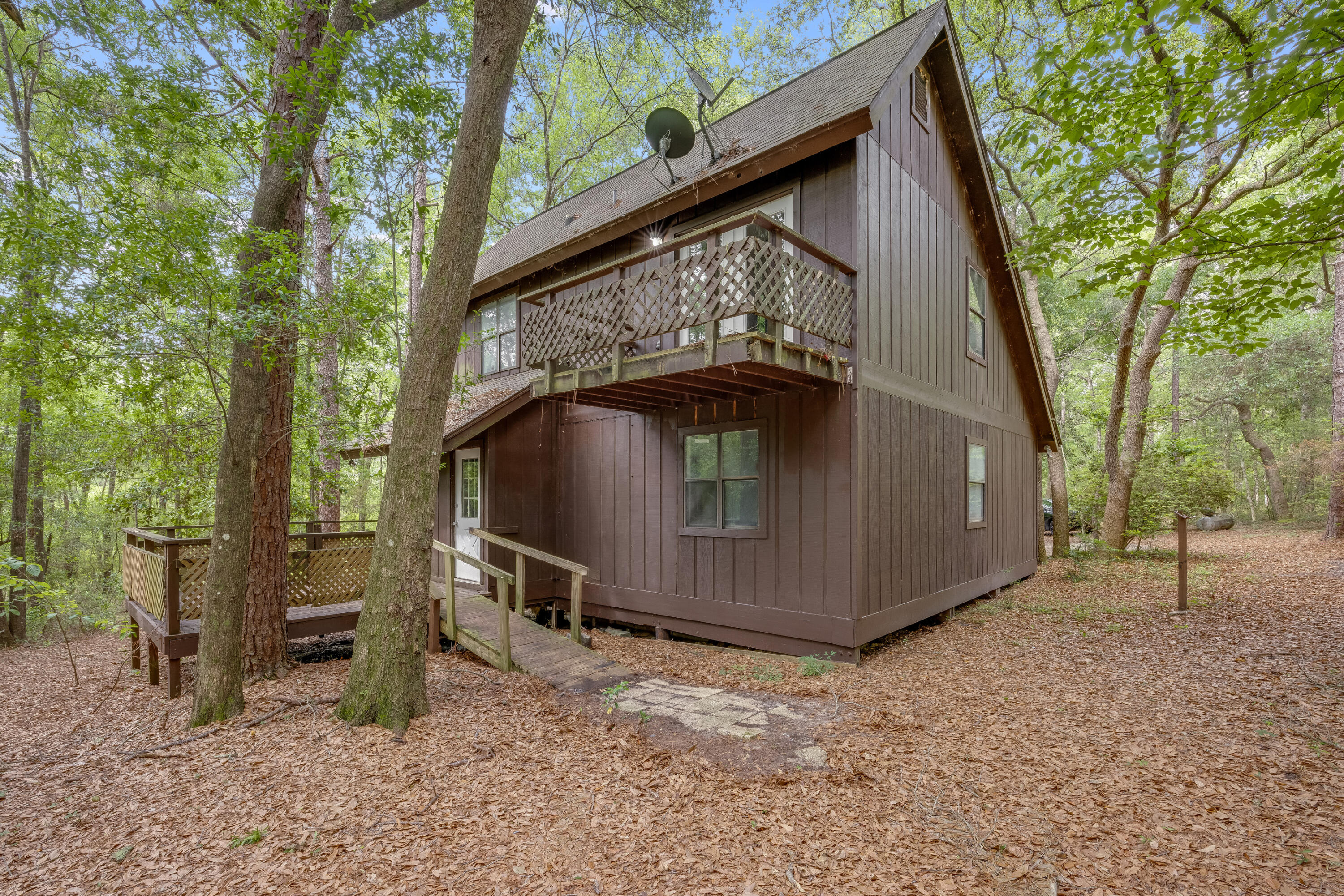4157 Sundance Way Holt, FL 32564 - Photo 29 of 30 a view of backyard with wooden fence and large trees