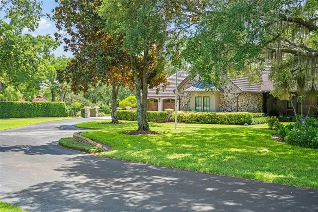 a spacious bathroom with a granite countertop sink and a large mirror