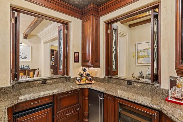 a view of a house with backyard porch and sitting area