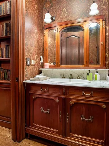 a living room with fireplace furniture and a fireplace