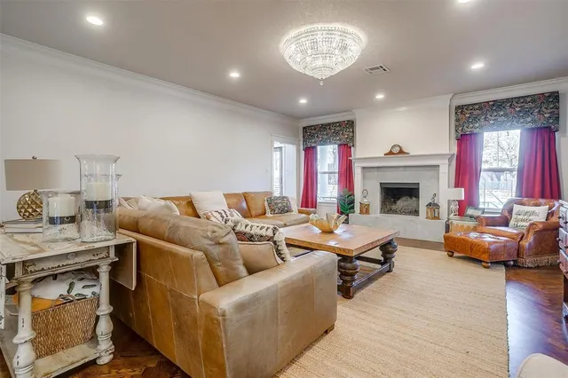 a spacious bedroom with a bed and a fireplace