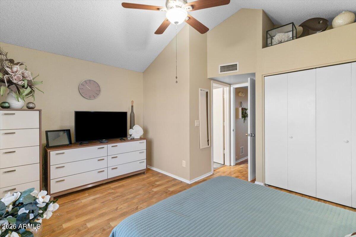 7905 West Thunderbird Road, Unit 285 Peoria, AZ 85381 - Photo 12 of 27 a bedroom with a bed and flat screen tv