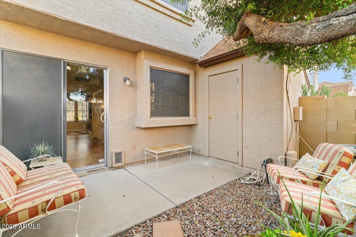 7905 West Thunderbird Road, Unit 285 Peoria, AZ 85381 - Photo 19 of 27 a backyard of a house with seating space