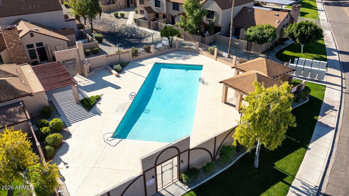 7905 West Thunderbird Road, Unit 285 Peoria, AZ 85381 - Photo 20 of 27 an aerial view of a house with a yard pool patio and outdoor seating