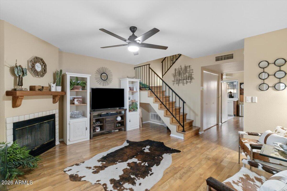 7905 West Thunderbird Road, Unit 285 Peoria, AZ 85381 - Photo 2 of 27 a living room with furniture and a flat screen tv