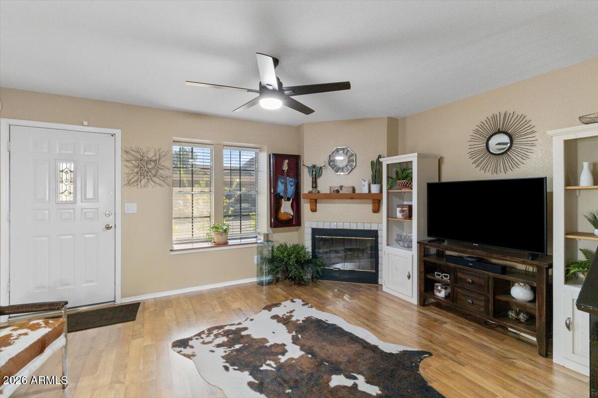 7905 West Thunderbird Road, Unit 285 Peoria, AZ 85381 - Photo 3 of 27 a living room with furniture and a flat screen tv