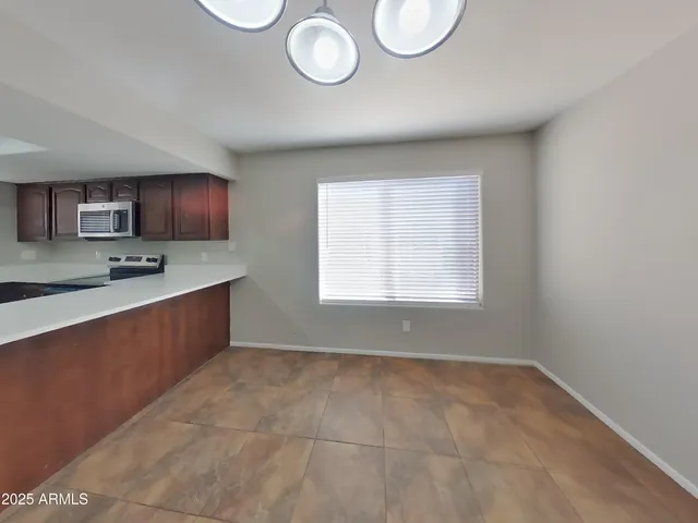 a kitchen with stainless steel appliances granite countertop a granite counter tops and a stove