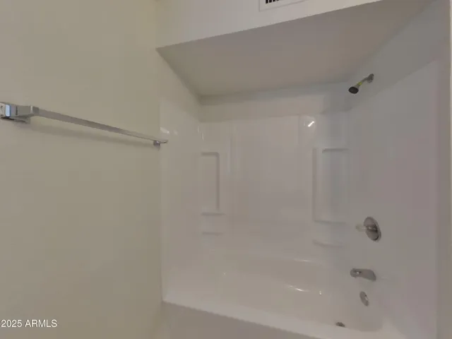 a close view of a bathtub in a bathroom